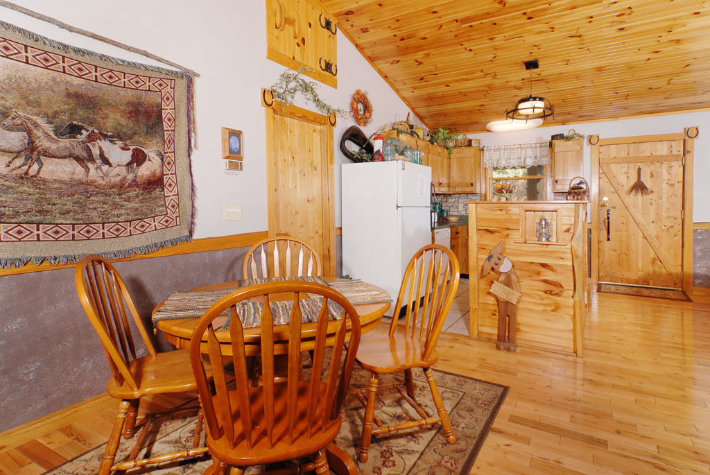 Pigeon Forge Cabin that has a cozy dinning area that is on the main level.